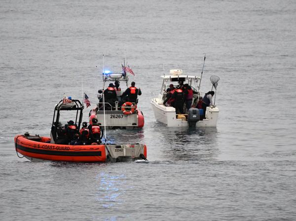 The crew of the Coast Guard Cutter Active (WMEC-618) interdicts 11 aliens aboard a 20-foot cabin cruiser boat