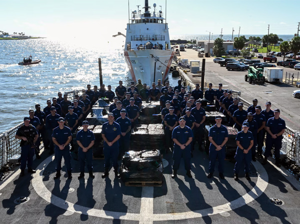 The crew of USCGC Resolute (WMEC 620) pose for a group photo during a drug offload at Coast Guard Sector St. Petersburg, July 17, 2025.